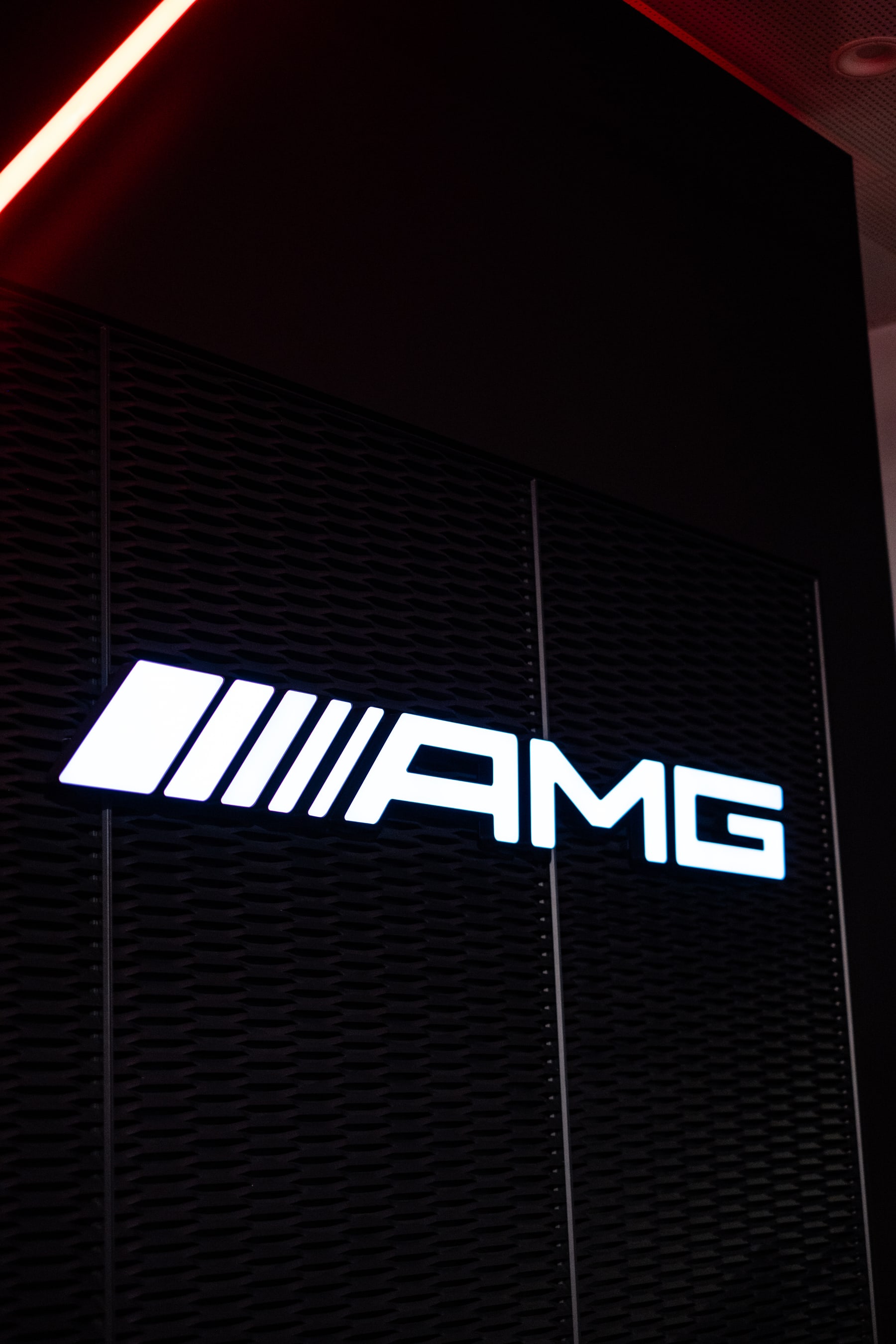 Illuminated AMG sign in the brand event space