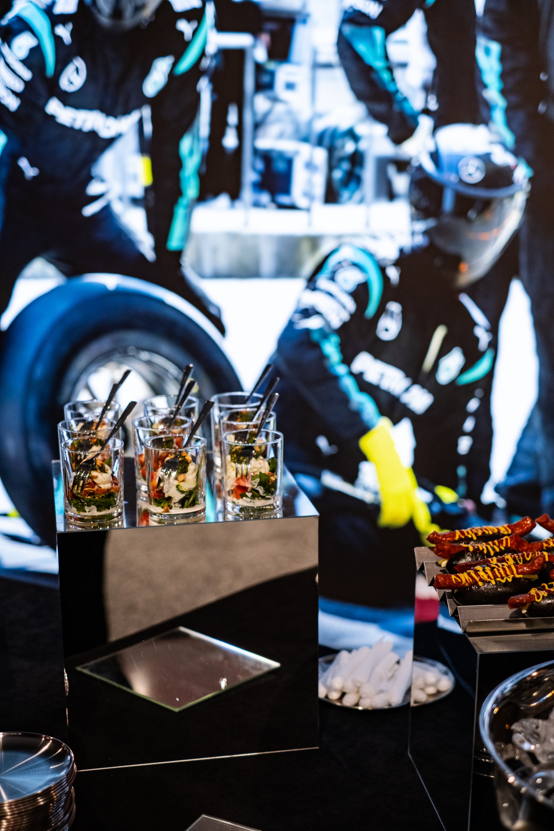 Good Catering bites against a Mercedes-AMG racing car image
